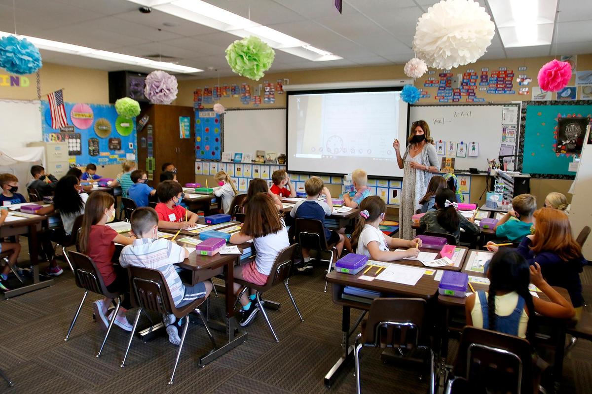 San Gabriel Elementary children walked on campus early Wednesday morning. Teacher Carol Leoni conducts the first day of a second grade class.
