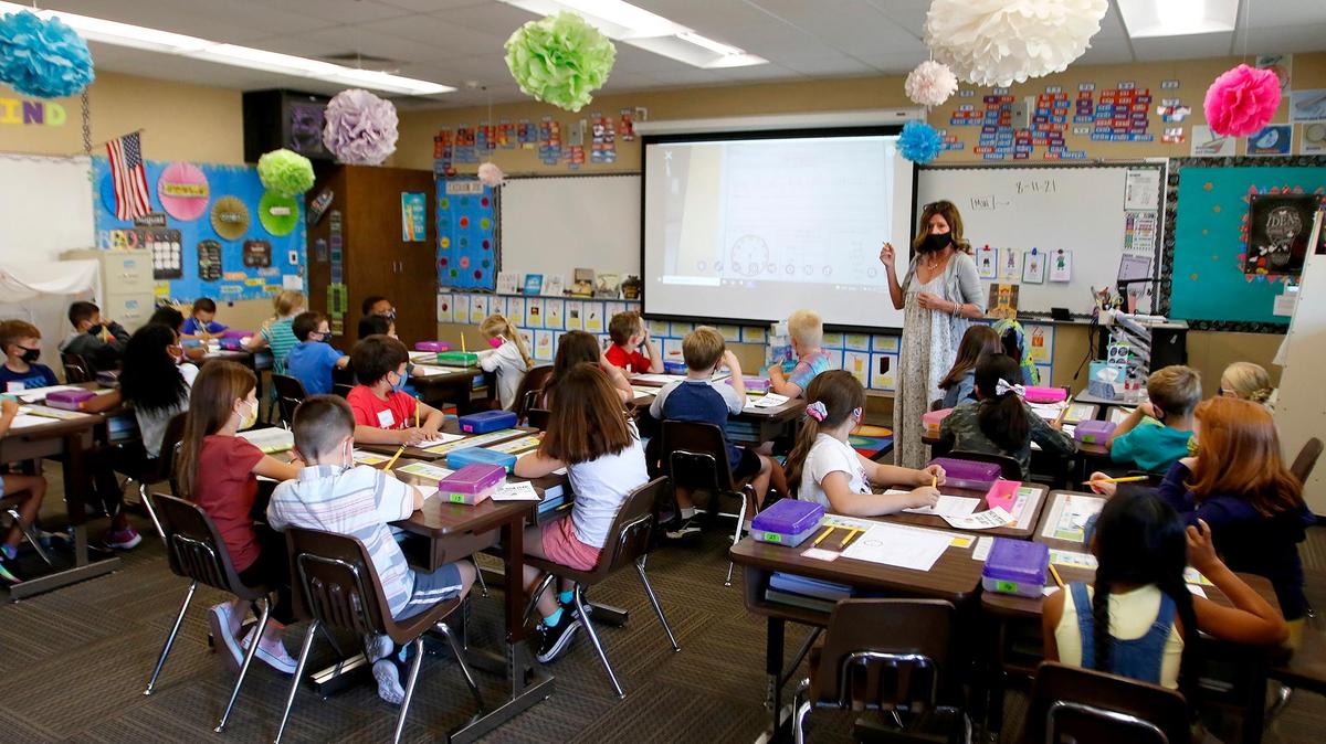 Second-grade teacher Carol Leoni talks to her class of masked kids at San Gabriel Elementary School in Atascadero on the first day of the 2021-22 year.