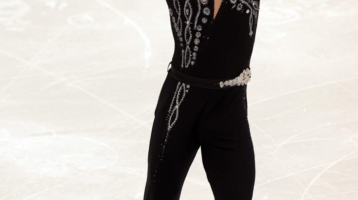 Evgeni Plushenko of Russia skates in the men's short program. (George Bridges / MCT)