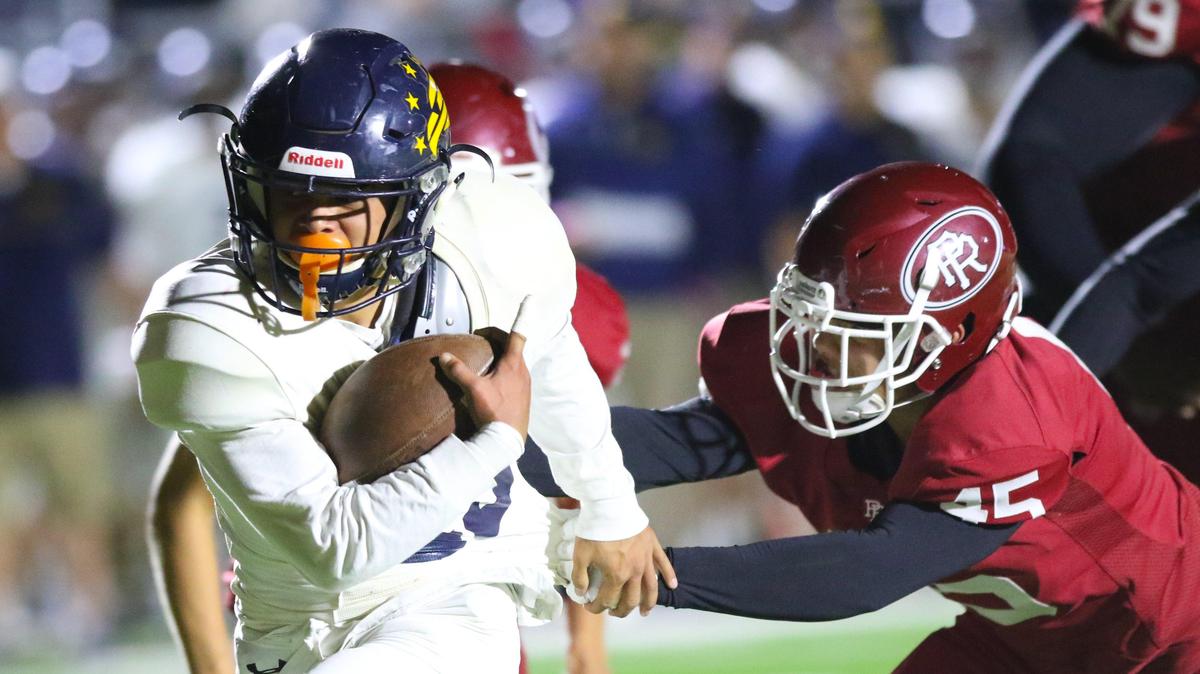 Arroyo Grande High School running back Mason Thompson runs for a touchdown as Paso Robles’ Devin Mowreader tries to stop him in the teams’ Mountain League opener Friday night.