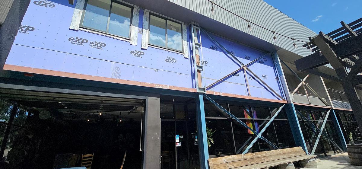 Exposed wrapping material can be seen at the entrance to Bang the Drum brewery, at the building at 1150 Laurel Lane in San Luis Obispo in March 2025. The tenants have been told they have to vacate the property due to unsafe construction conditions.