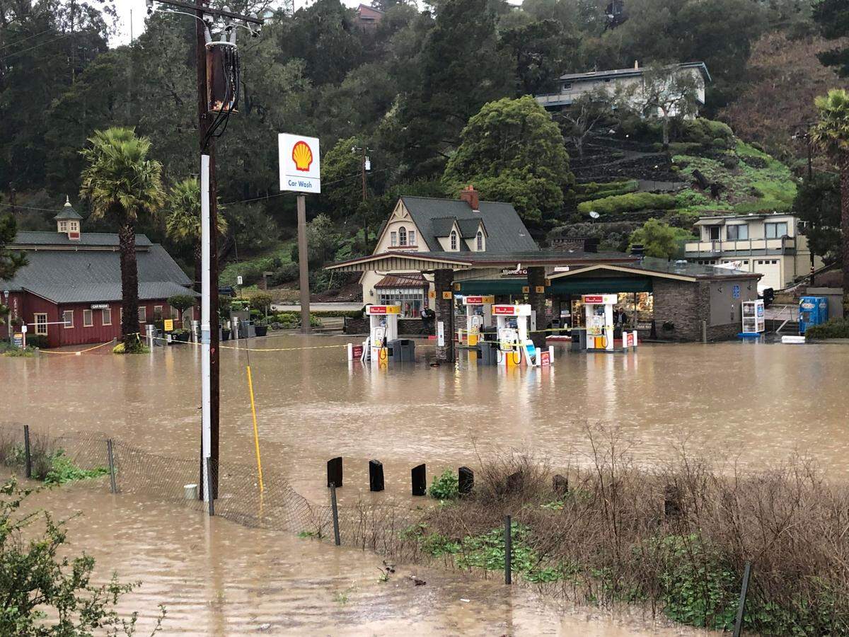 Floodwaters inundate the Old Cambria Shell Station, Main Street and a creek area in the town’s West Village on Jan. 9, 2023. It was the second day of flooding during the recent series of “bomb cyclone” storms.