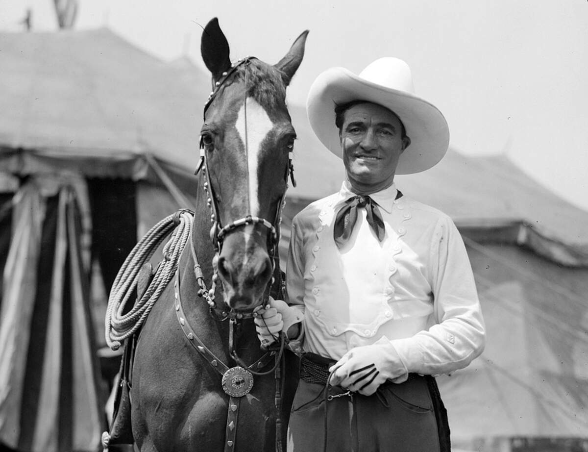Early Western movie star Tom Mix with his horse Tony at the circus.