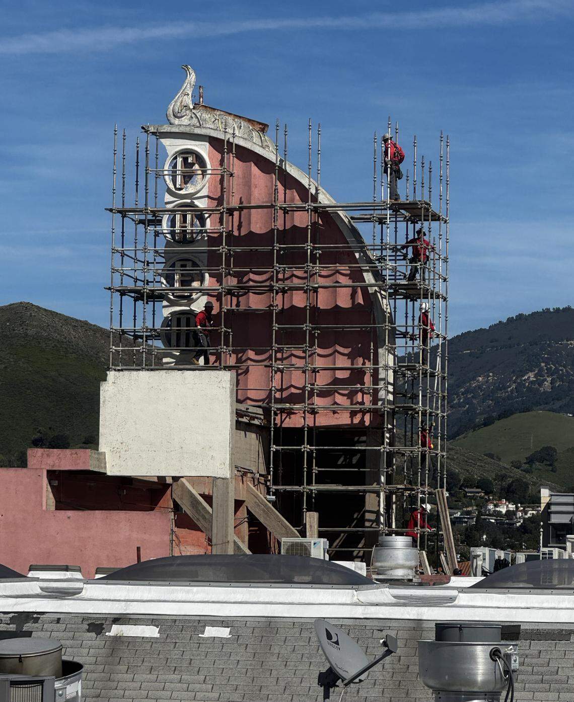 Workers put up scaffolding beside the Fremont Theater’s sign on Feb. 25, 2026, in San Luis Obispo. The theater’s iconic sign was damaged in a storm on Feb. 17.