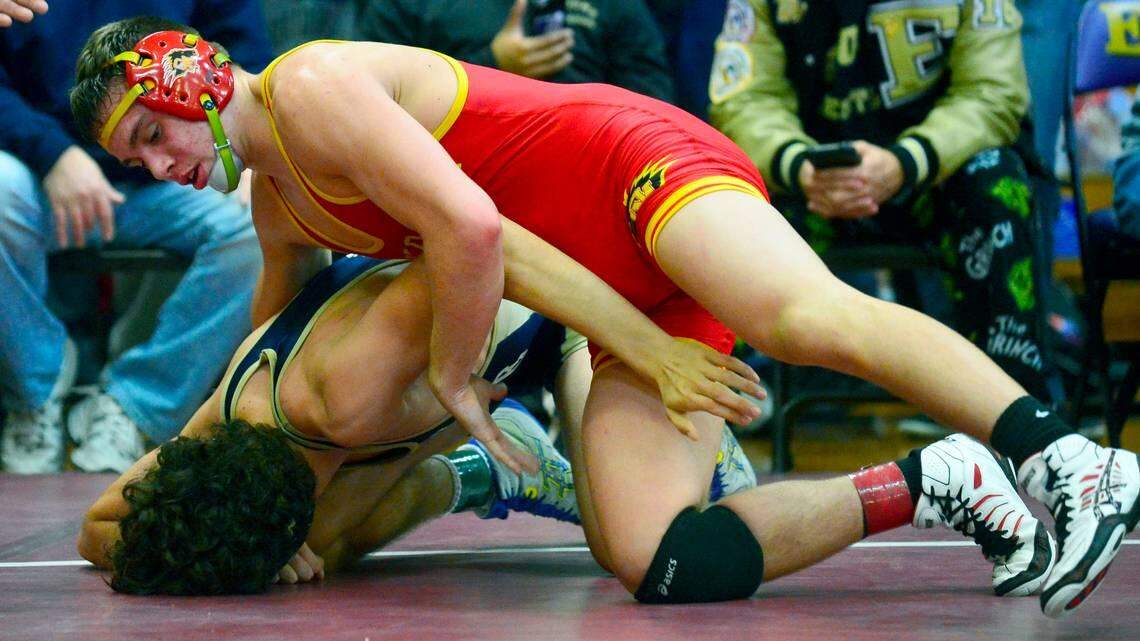 Oakdale's Bronson Harmon holds his opponent down in the 154 finals during the Engel Wrestling Tournament in Escalon at Escalon High School on January 9, 2016. Harmon was a Cal Poly wrestling recruit until the university saw video of him using an anti-gay slur during a counter protest in Modesto.