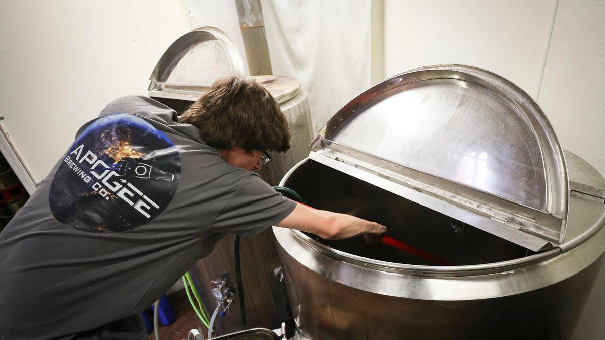 Apprentice brewer Corey Rogers cleans brewing equipment. Apogee Brewing Co. in Grover Beach has won national awards for their beer, seen here on Nov. 4, 2024.