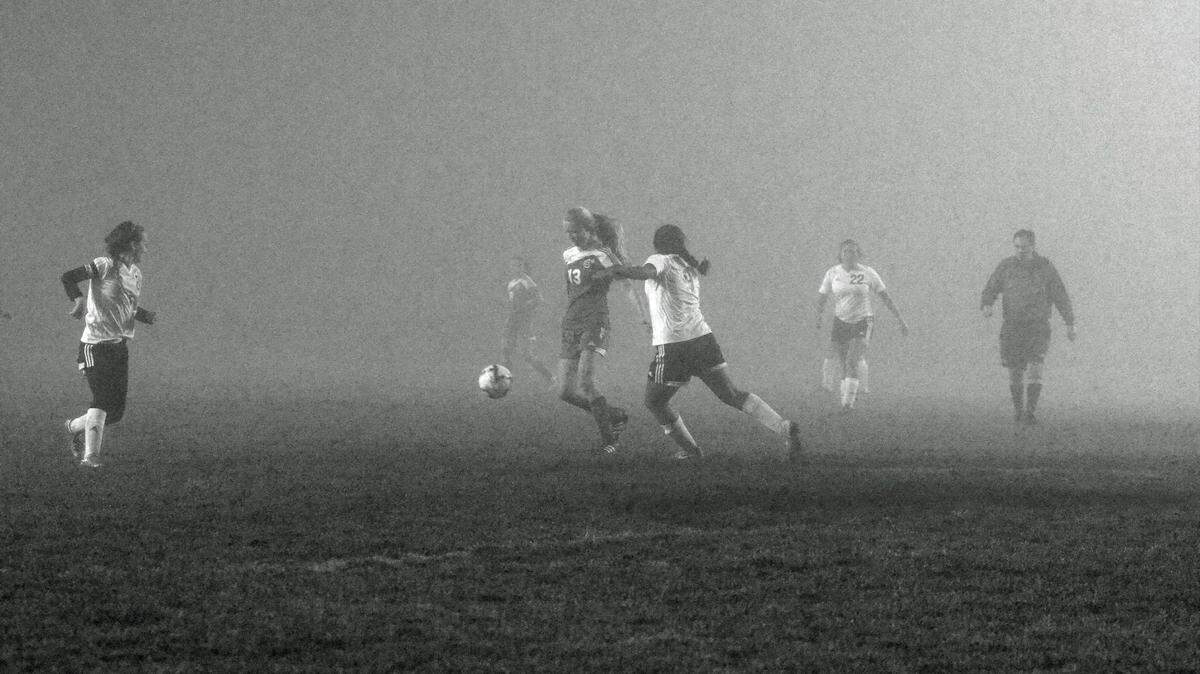 Chloe Lindsey (13) plays soccer in the fog at Nipomo High School.