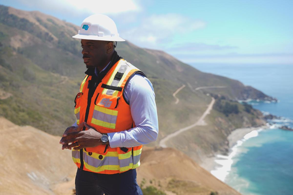 California Secretary of Transportation Toks Omishakin speaks to media and Caltrans officials atop Regent’s Slide on the Big Sur coast, pictured Thursday, July 17, 2025. Regent’s Slide closed Highway 1 around 27 miles north of the San Luis Obispo-Monterey county line in February 2024.