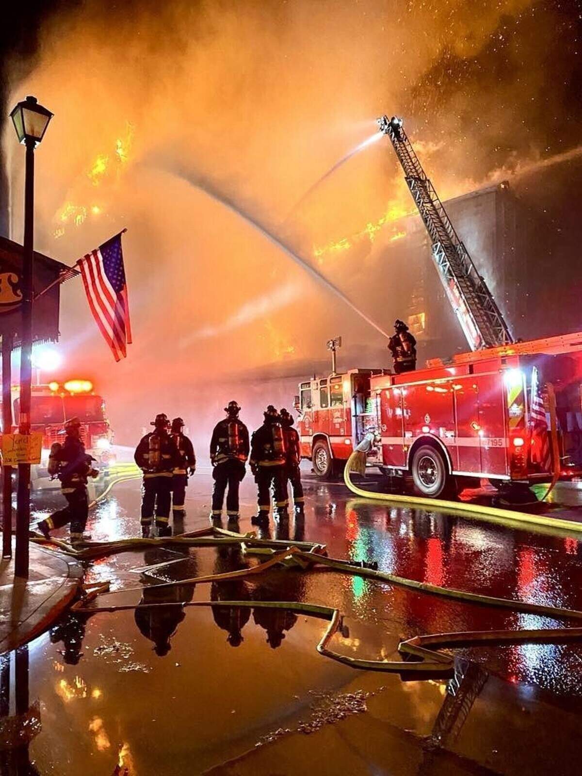 Firefighters from Templeton and neighboring agencies battle the Feed & Grain fire on July 4, 2025. Crews kept the blaze from spreading to surrounding downtown businesses after flames engulfed the longtime Feed & Grain building.