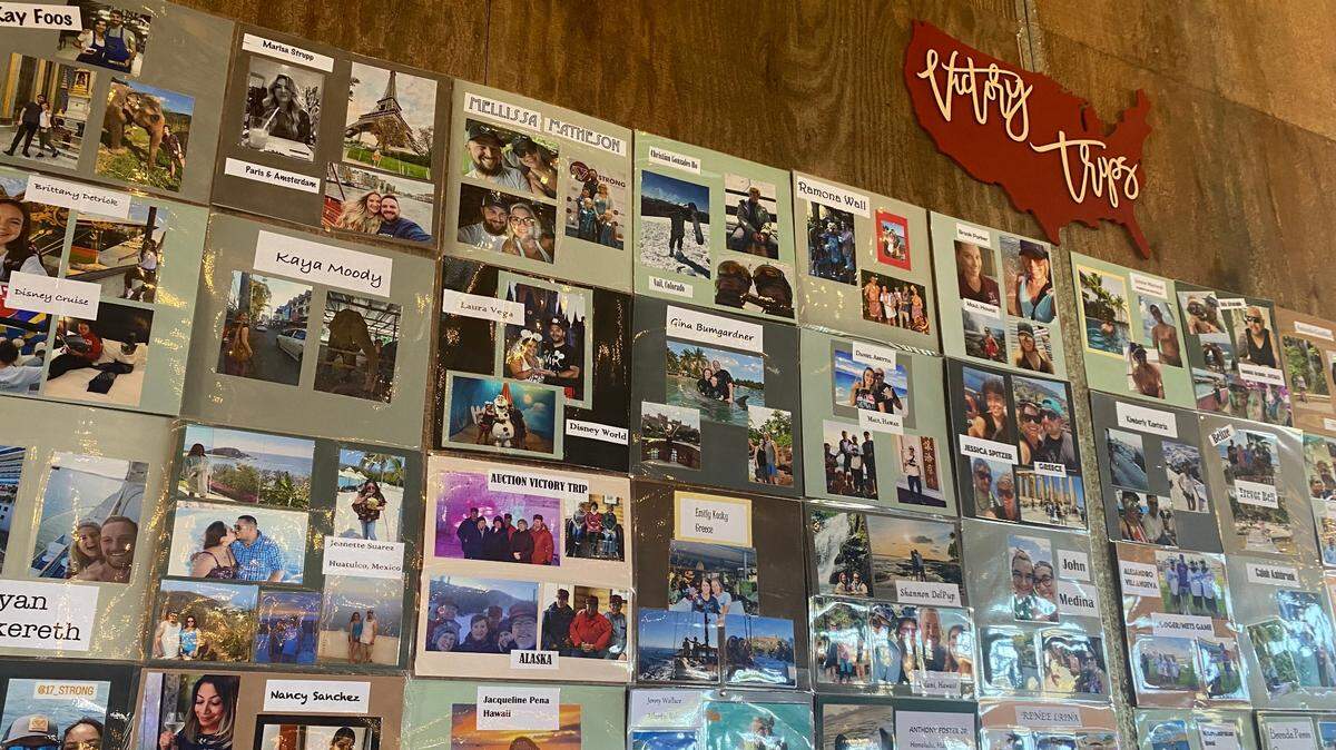 A wall of photos shows 17 Strong recipients on their travels, as part of the Victory Trip Celebration on Aug. 14, 2022.