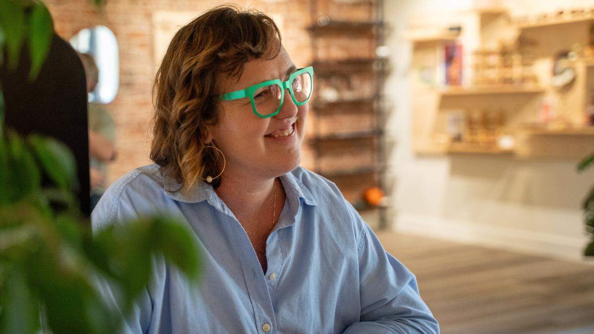 Kyla Skinner, owner of Specs by Kyla, sits in her El Camino Real store the on the first day since it reopened on Tuesday, April 14, 2026.