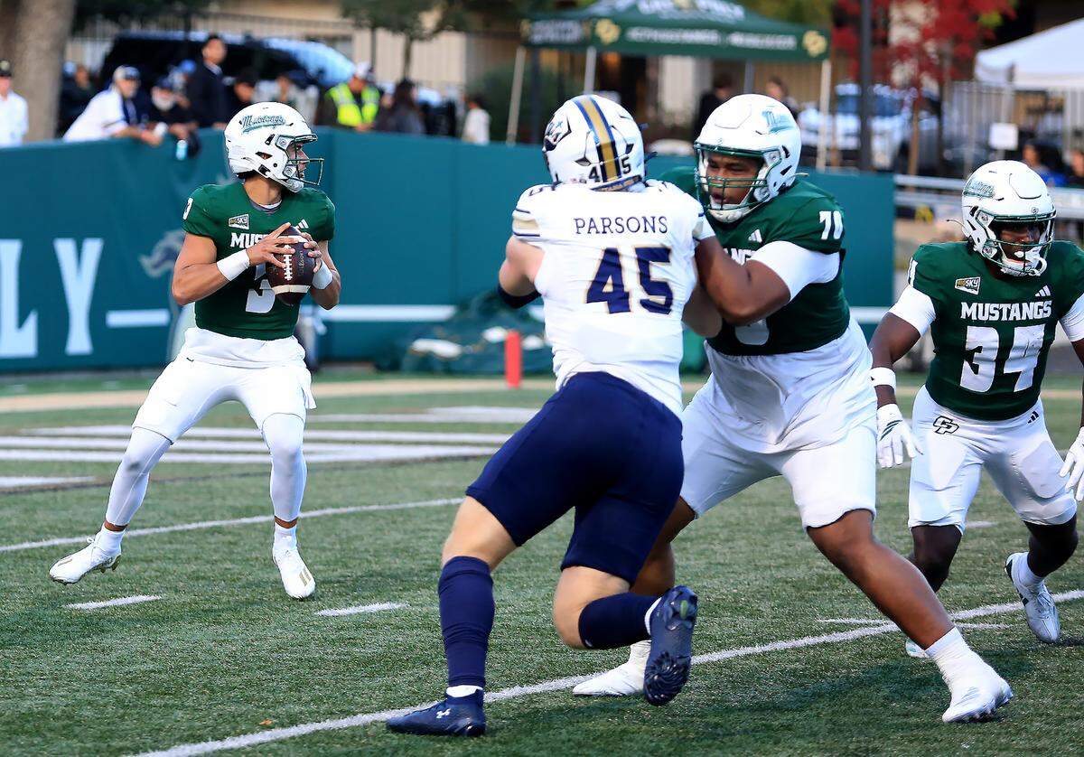 Bo Kelly looks to pass the ball while being defended by Mustang players Charlie Adams and Kedric Sanders. Cal Poly fell to Montana State 34-17 in a college football game at Mustang Memorial Field on Oct. 25, 2025.