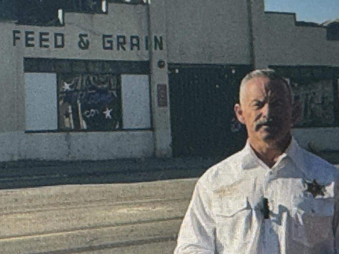 A screen shot of campaign video of Sheriff Chad Bianco, a candidate for California governor, in front of Templeton Feed & Grain, which was partially destroyed in July 4 fire.