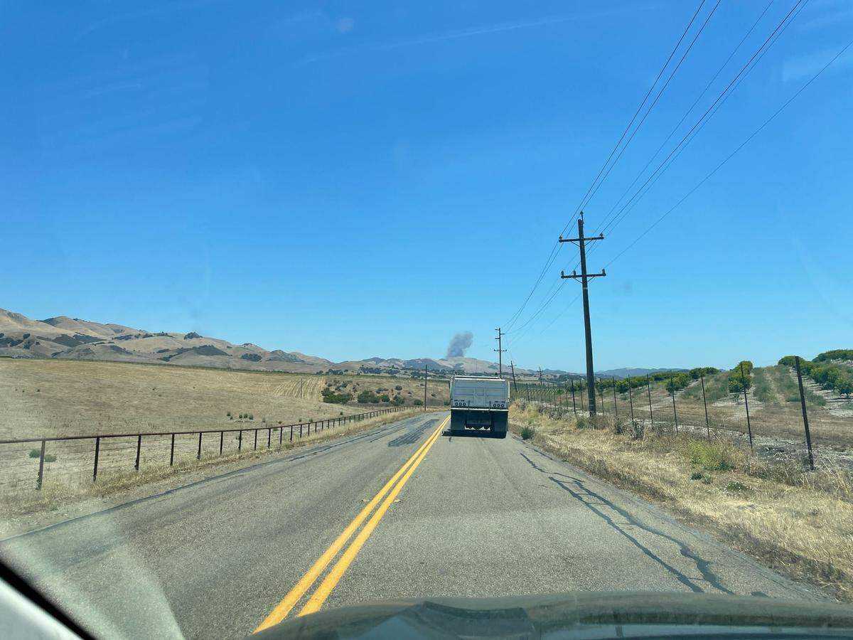 A fire near Huasna sends up a column of smoke on Tuesday afternoon, June 28, 2022.