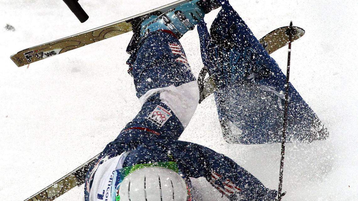 Bilodeau masters moguls, gives Canada its first gold