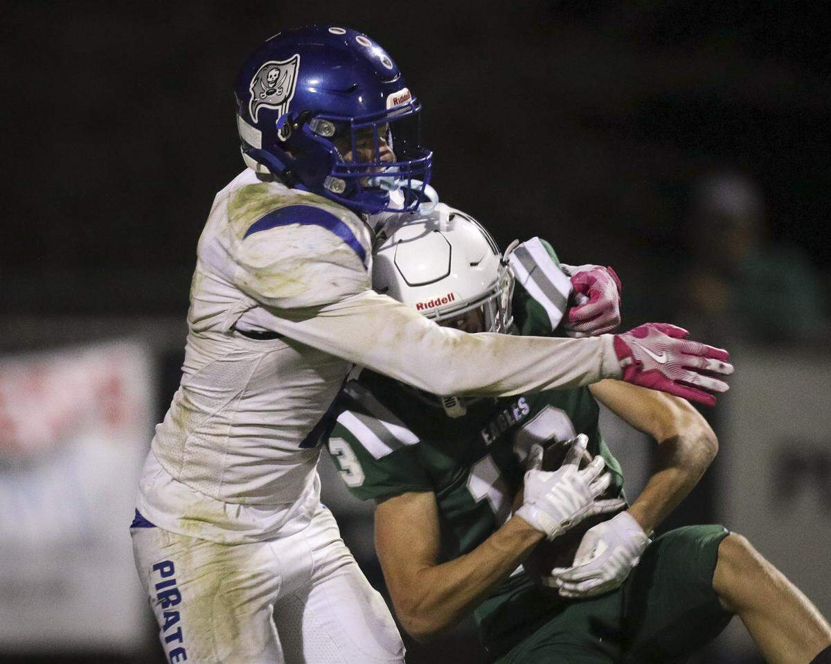 Renner Wicks make his second interception cutting in front of Trevor Riddiough. Templeton beat Morro Bay 56-14 in football game seen here on Oct. 9, 2025.