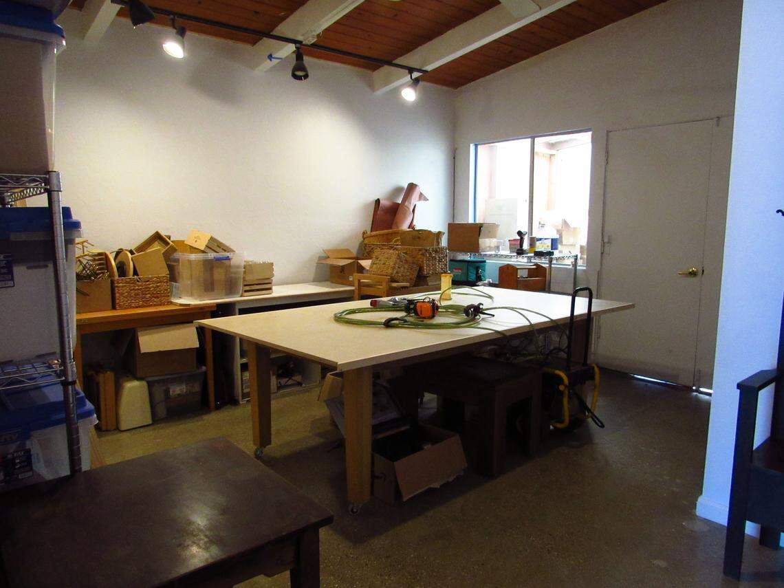 The room behind Estero Bay Art + Craft is still in construction, with its owner Hilary Soldati building a large tables for events and workshops.