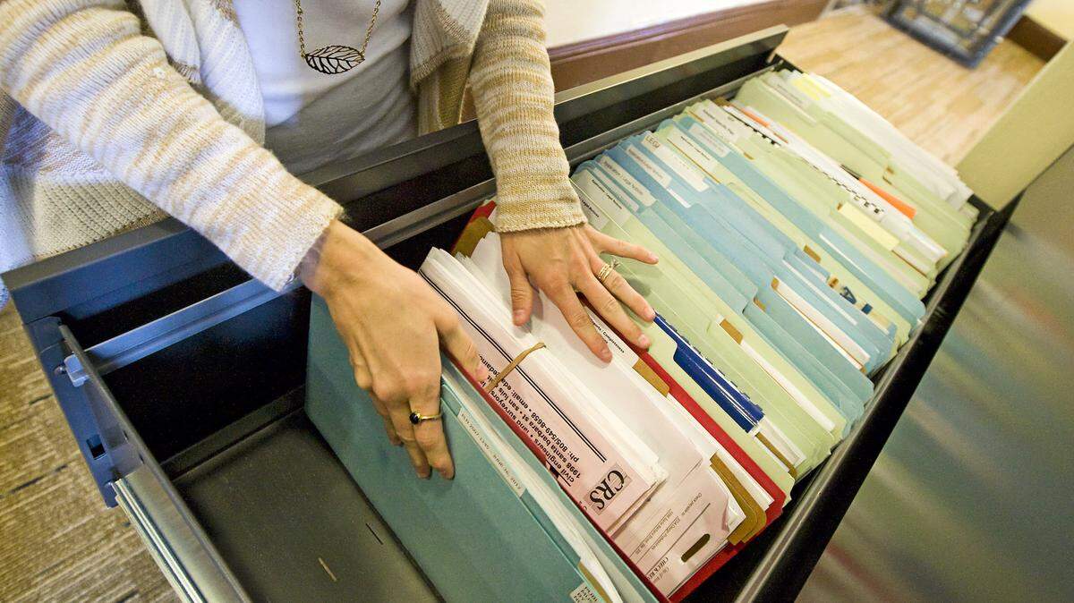 Atascadero's email policy requires employees to decide if an email is a public record that should be printed out, or just routine correspondence that can be deleted. Tribune reporter Tonya Strickland combs through city files in search of emails pertaining to negotiations between Atascadero and Wal-Mart.