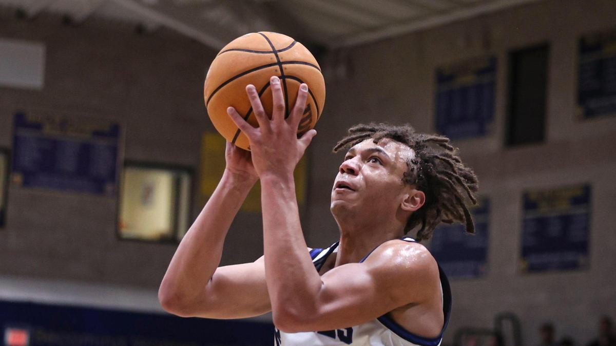 Jayden Nozil takes a pass to the basket. Mission Prep beat Frontier 67-55 on Feb. 21, 2025, to advance to the Division 2 CIF Central Section basketball final.