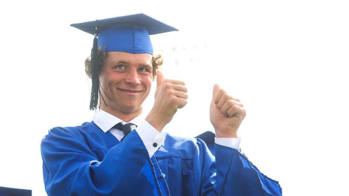 Hayden Davis gave the ceremony two thumbs up. Morro Bay High School held graduation ceremony at the football stadium June 9, 2022.