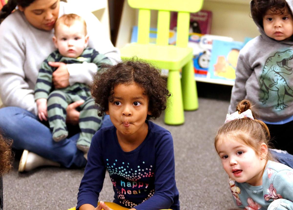 Children attend a lively story hour at the new Templeton Community Library, courtesy of retired librarian and volunteer Kristen Barnhart. Isabella Anderson, 5, Templeton makes “duck lips” while Barnhart reads a book about cute ducks.