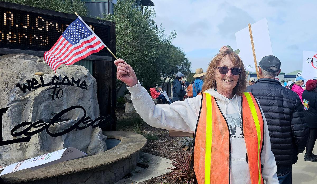 Hundreds of people gathered at the intersection of Los Osos Valley Road and South Bay Boulevard to protest the current administration on Saturday, Mar. 1, 2025,. Maryanne Meyer, of Los Osos, protest organizer, said she registered the protest with Indivisible three weeks ago.