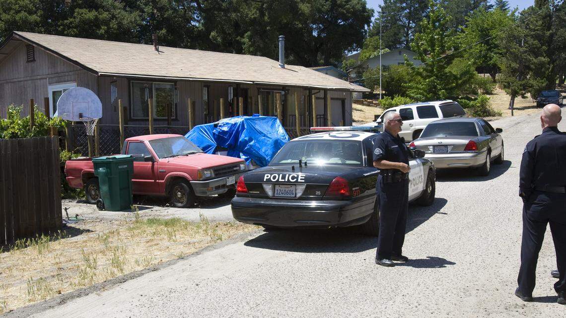 Atascdero police officers and volunteers keep the crime scene secure Thursday during a homicide investigation on Tranquilla Avenue.
