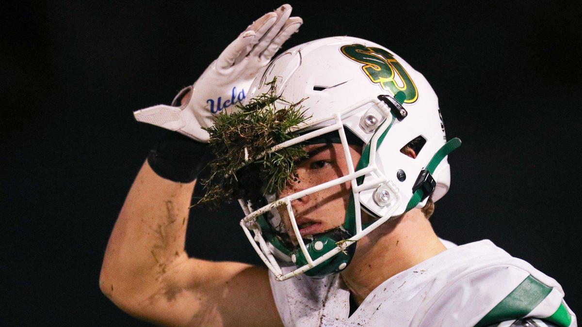 A St. Joseph player came up with a piece of the field in his facemask. Mission Prep fell to St. Joseph 49-21 on Oct. 28, 2022, in the last game of the regular season, giving the Knights the Mountain League football championship.
