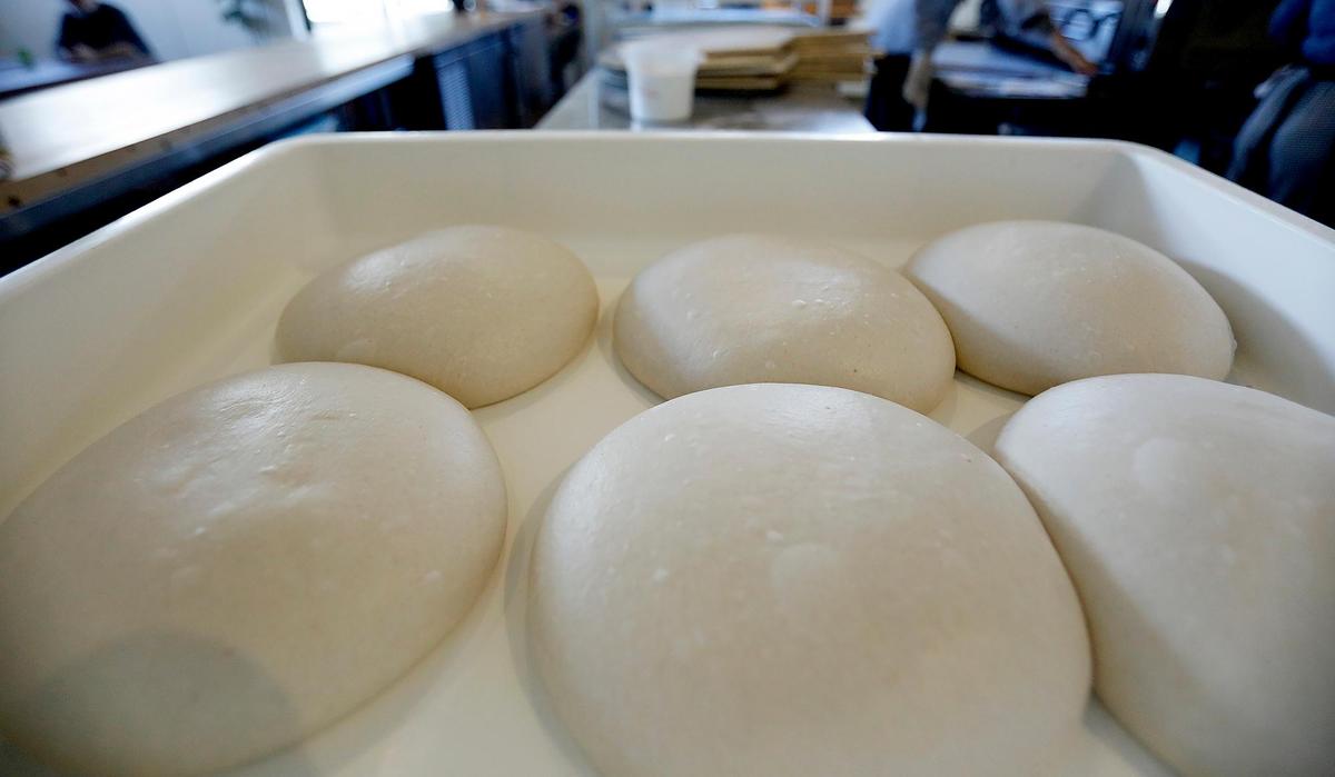 Sour dough pizza mounds ready to spin into pies. Over the past two years My Friend Mike’s pizzeria in San Luis Obispo has grown a loyal following. No night goes by where the shop doesn’t sell out.