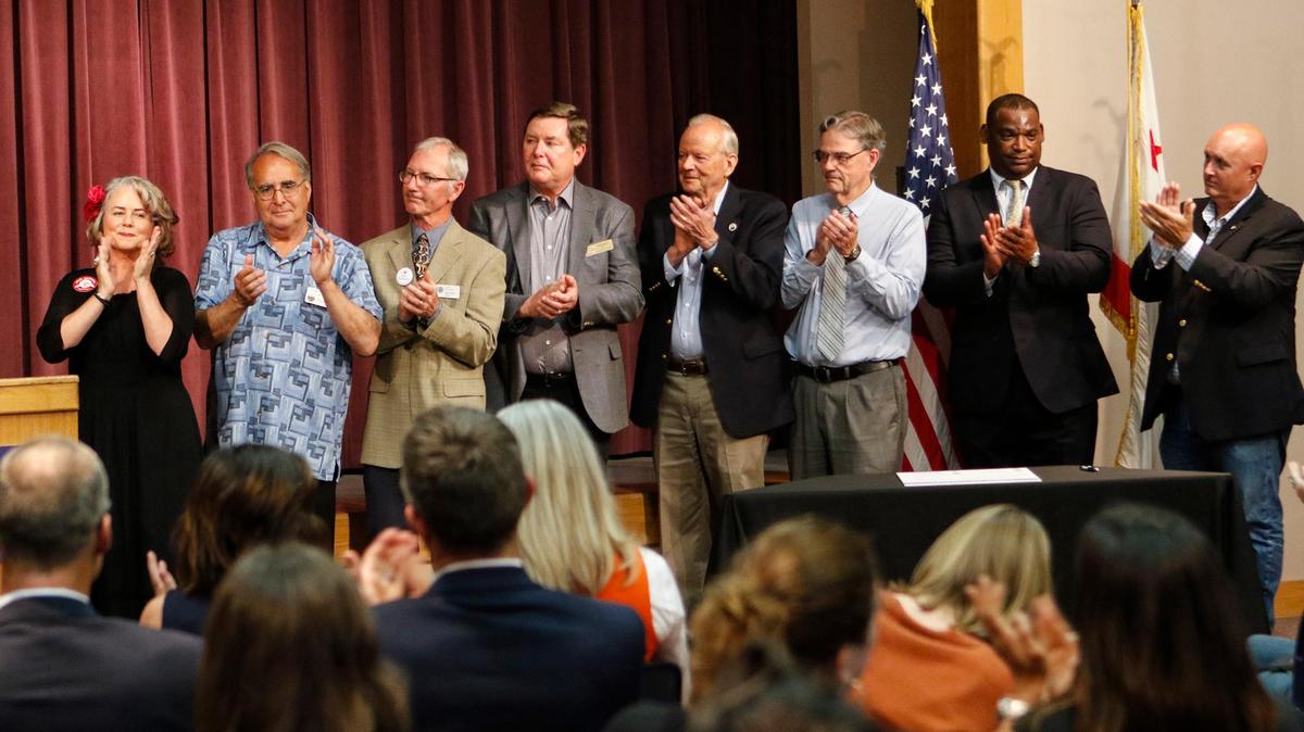 Local officials in San Luis Obispo County applaud the adoption of a code of civility. From left, mayors Heidi Harmon, San Luis Obispo; Tom O'Malley, Atascadero; Jamie Irons, Morro Bay; Jim Hill, Arroyo Grande; Ed Waage, Pismo Beach; Steve Martin, Paso Robles; John Shoals, Grover Beach; and John Peschong, chairman of the San Luis Obispo County Board of Supervisors.