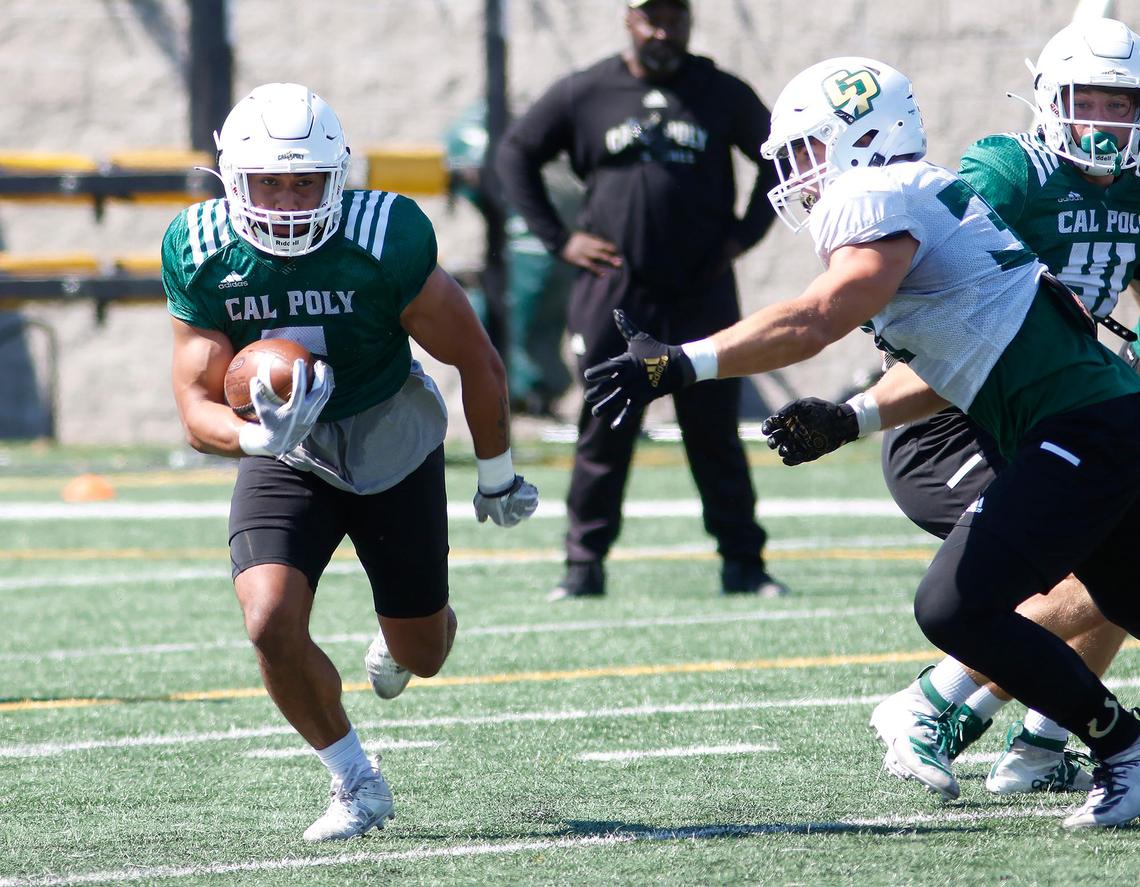Lepi Lataimua, a running back for Cal Poly, makes a play at a recent practice game.
