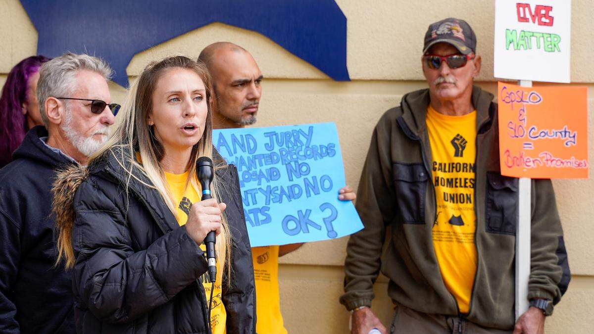 Former Oklahoma Avenue Safe Parking site resident and California Homeless Union member Mallory Mejia speaks during a demonstration Tuesday afternoon at the Katcho Achadjian Government Center. The San Luis Obispo County chapter of the California Homeless Union filed a lawsuit against San Luis Obispo County and the Community Action Partnership of San Luis Obispo related to the operation of the safe parking site and treatment of its residents.