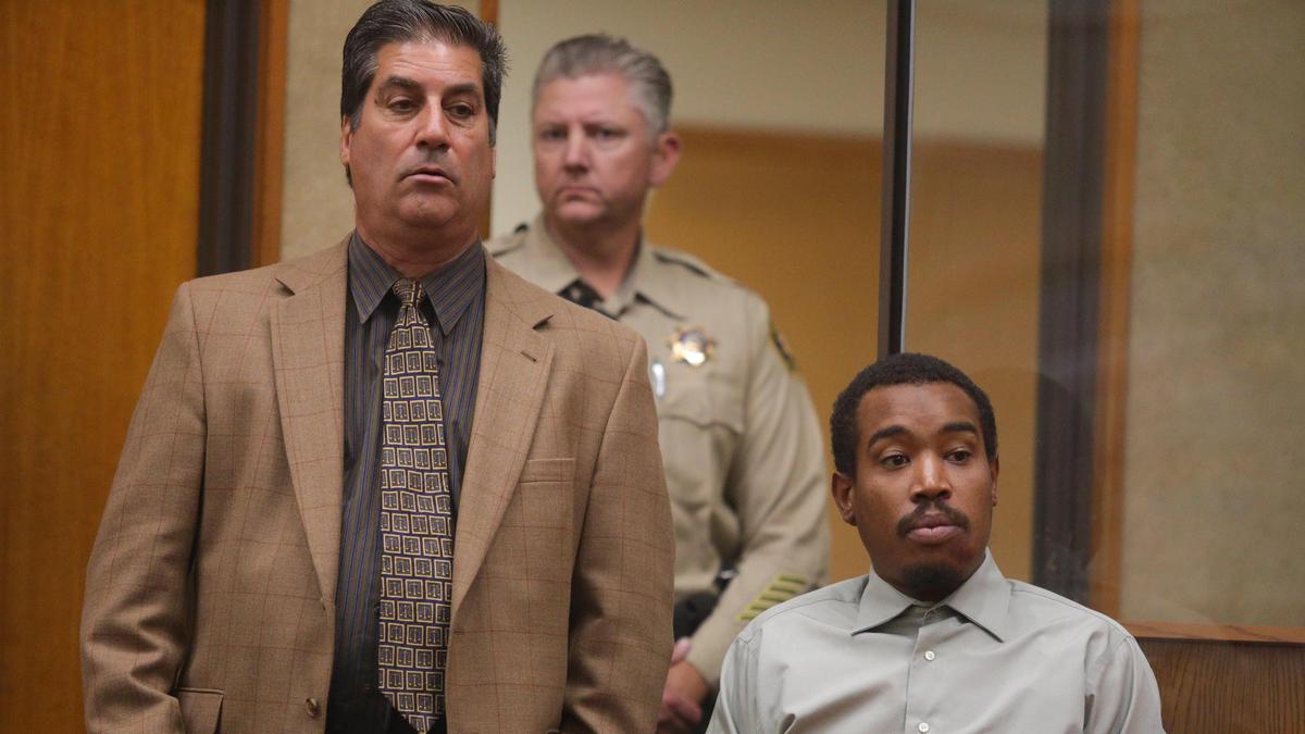 Seated at right, Kejuan Guy Bynum, 26, of Atascadero, appeared in court June 7 for an alleged parole violation. Linden Mackoui attorney at left and Sheriff’s Deputy Richard Johnston is in background. Bynum is accused of the June 1 fatal stabbing of Cristopher Vento Wilson, 23, in Shandon.