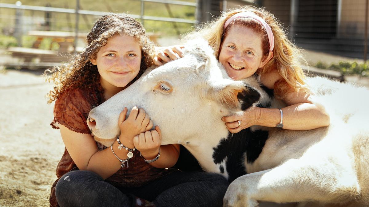 Zoe Rosenberg, 15, and her mother Sherstin Rosenberg visit Buddha, who was rescued from a dairy, at their animal sanctuary in San Luis Obispo.