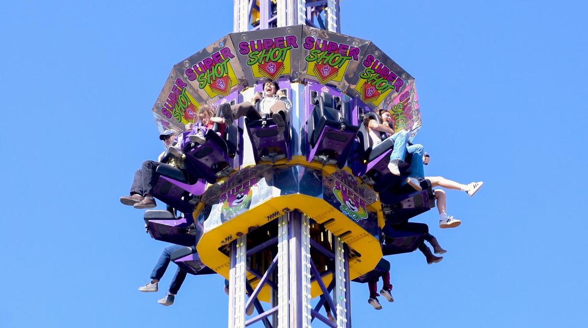 Tribune news reporter Angel Corzo rides the Super Shot at the California Mid-State Fair on Wednesday, July 16, 2025. The Mid-State Fair will run from July 16-27.