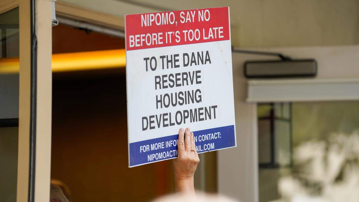Supporters and opponents of the Dana Reserve housing development try to crowd into a Nipomo Community Services District meeting Wednesday, Aug. 28, 2024. The Nipomo CSD voted to approve the terms of an annexation agreement with San Luis Obispo County that would bring the Dana Reserve land into the CSD’s sphere of influence.
