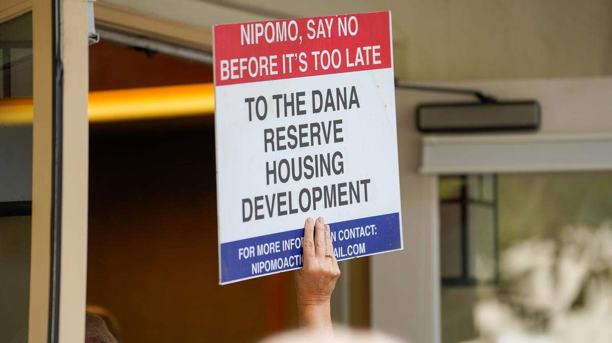 Supporters and opponents of the Dana Reserve housing development try to crowd into a Nipomo Community Services District meeting Wednesday, Aug. 28, 2024. The Nipomo CSD voted to approve the terms of an annexation agreement with San Luis Obispo County that would bring the Dana Reserve land into the CSD’s sphere of influence.