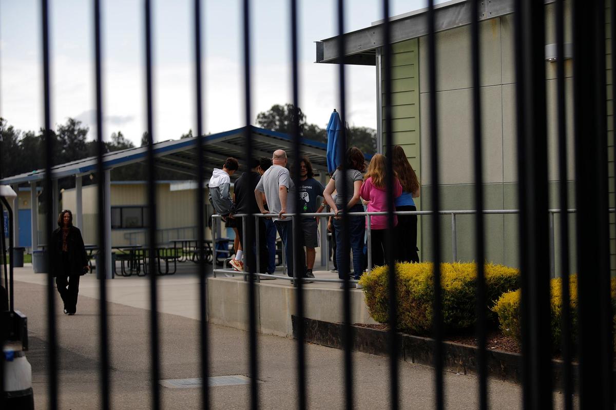 Students and teachers stood near the Central Coast New Tech High School office while sheltering in place on Sept. 19, 2024.