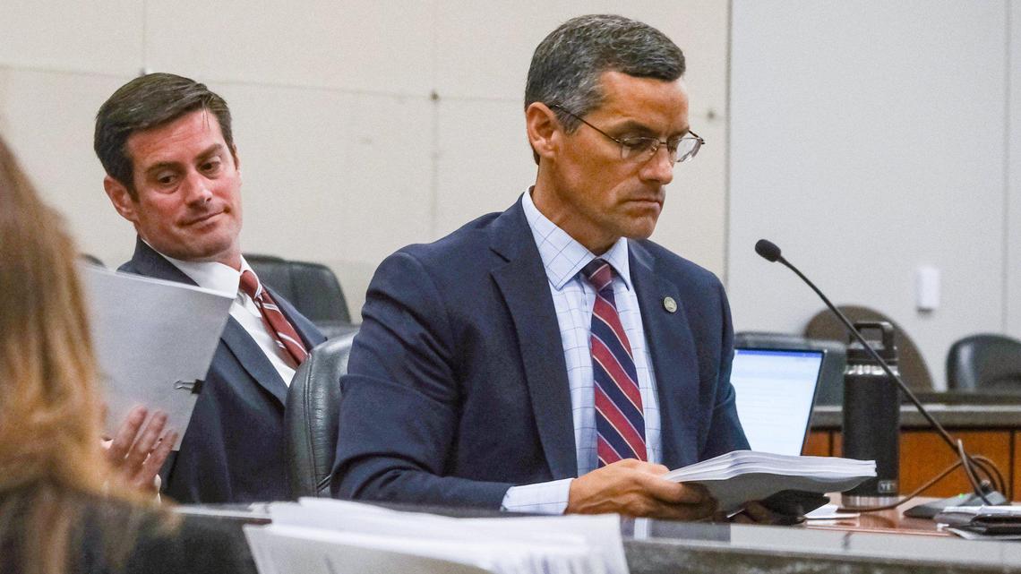 San Luis Obispo County Deputy District Attorney Chris Peuvrelle, left, reaches for papers behind Assistant District Attorney Eric Dobroth during pretrial motions for Paul and Ruben Flores in the Kristin Smart murder case in Monterey County Superior Court in Salinas, California, on June 6, 2022. Paul Flores is alleged to have killed Cal Poly student Kristin Smart after an off-campus party in May 1996. He was the last person seen with the Cal Poly student. Ruben Flores, Paul Flores’ father, is charged with accessory after the fact. The two were arrested in April 2021 — 25 years after Smart’s disappearance. Smart’s body has never been found. Change of venue was granted to move the trial from San Luis Obispo to Monterey County.