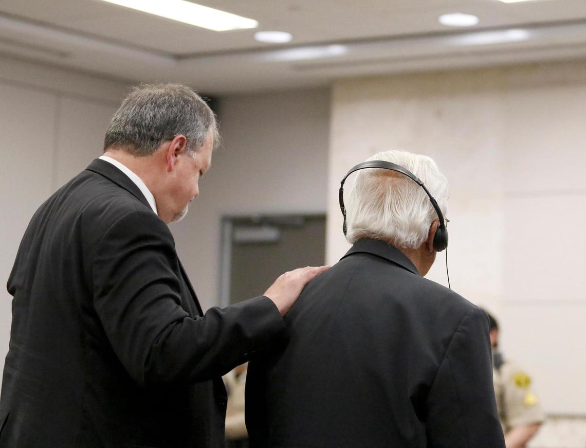 Defense attorney Harold Mesick, left, puts his hand on the shoulder of his client, Ruben Flores, after the jury acquitted Ruben Flores of helping his son, Paul Flores, cover up the murder of Cal Poly student Kristin Smart. The jury’s verdict was read in Monterey County Superior Court on Tuesday, Oct. 18, 2022, following a trial.