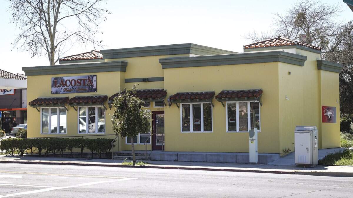 The location of Pill Save Pharmacy in Atascadero on El Camino Real at Santa Rosa Road on March 9, 2026. Next door is LACOSTA Hair Salon.