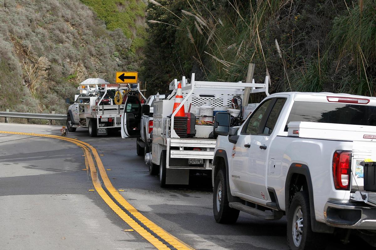 Souza Construction trucks are at the site of the rock slide south of Ragged Point on Jan. 5, 2023. Mesh was unable to contain a slide that slipped onto Highway 1.