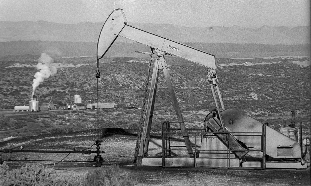 Pumpjack brings up oil from well at Guadalupe oil field. Steam in background was used to help get the asphalt-like oil to the surface. Union Oil Co. would later be known as Unocal. Photo is from Jan. 2, 1980.