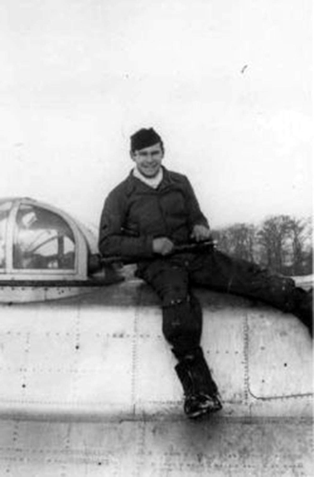 Sgt. Al Spierling atop the turret guns on his B-17.