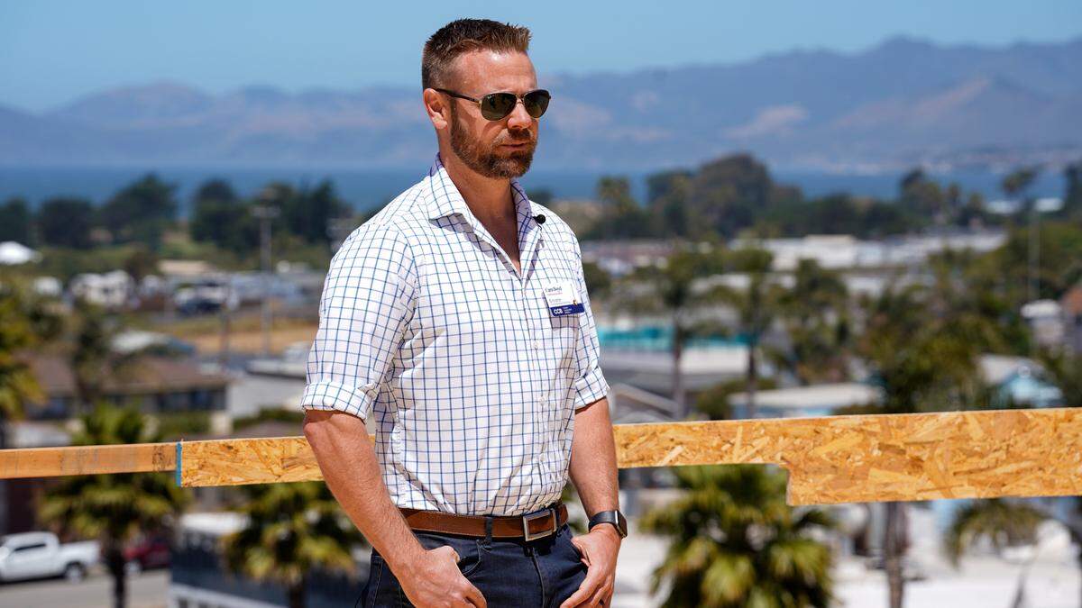 Coastal Community Builders CEO Cam Boyd speaks to guests visiting the “Palladium” mixed-use project on West Grand Avenue following the groundbreaking ceremony for “Encore,” another mixed-use condo complex, Thursday, June 27, 2024. The projects are located at the end of streetscape improvements currently in progress starting at the intersection of West Grand Avenue and 4th Street.