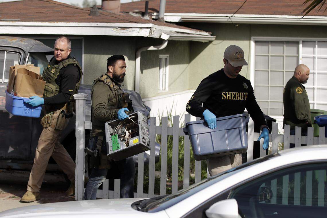 Members of the Los Angeles County Sheriff’s Department remove items after a searching a home in connection with a cold case Wednesday, Feb. 5, 2020, in Los Angeles. Search warrants were served Wednesday at locations in California and Washington state in the investigation of the disappearance of Kristin Smart, the Cal Poly student who disappeared in 1996. 