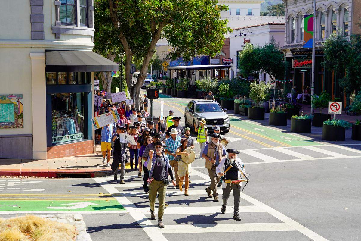 Protesters take to the streets during the No Kings protest in San Luis Obispo on Saturday, March 28, 2026. Organizers estimated around 2,500 people attended the San Luis Obispo protest, with more in Atascadero, Cambria and Grover Beach.