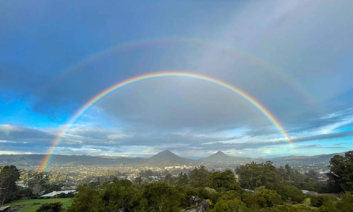 A double rainbow arches over San Luis Obispo during a break in Wednesday’s storm.