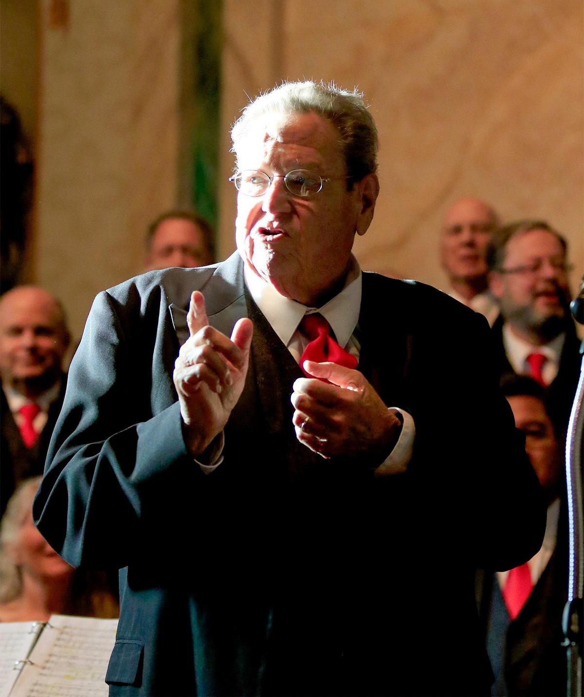 Director Gary Lamprecht leads the San Luis Obispo Vocal Arts Ensemble during a concert featuring a 50-person adult choir performing holiday tunes at Mission San Luis Obispo in 2016. Lamprecht died on Wednesday, Feb. 21, 2024, at the age of 78.