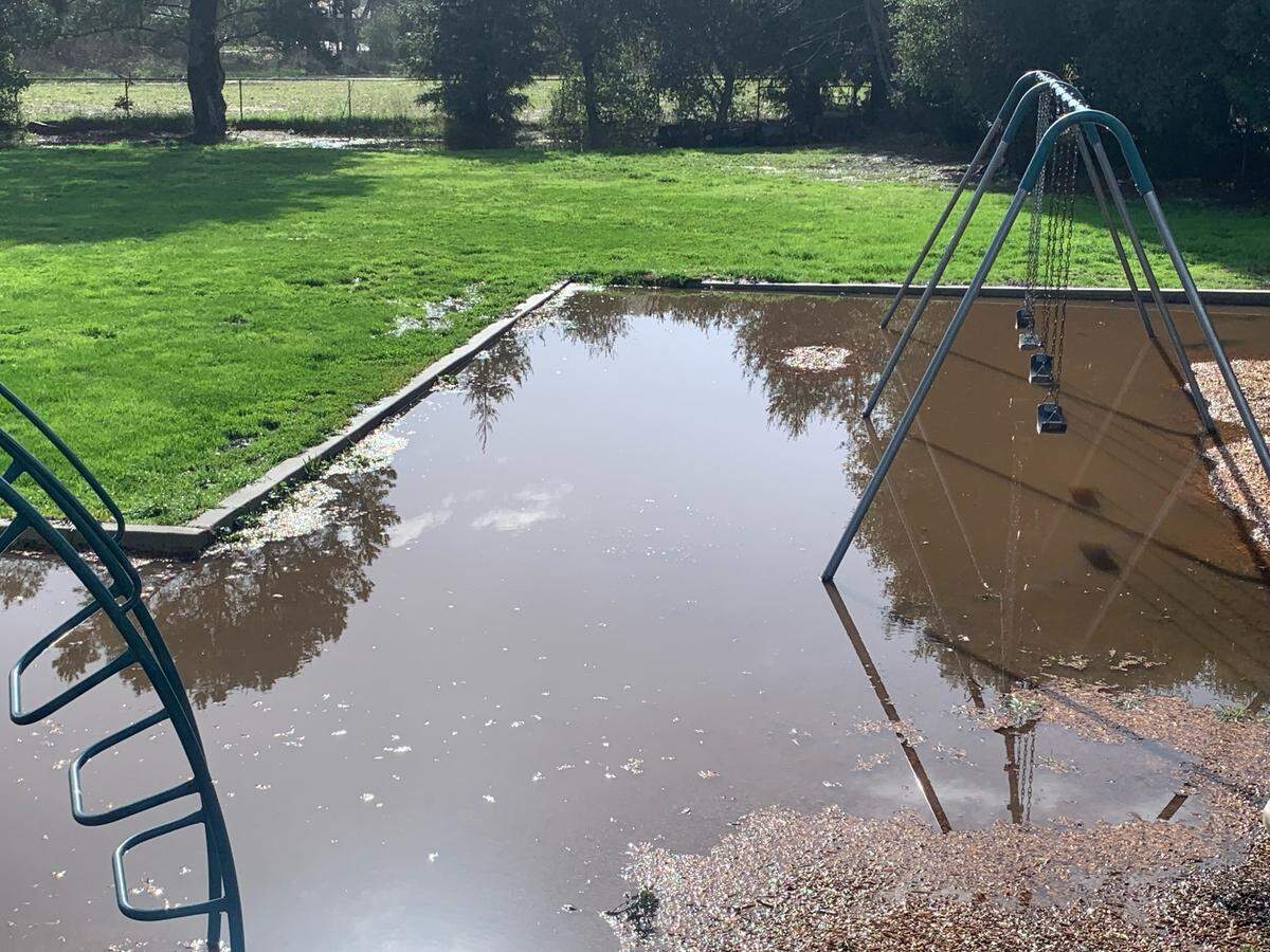The playground at Bellevue-Santa Fe Charter School near Avila Beach is flooded on Tuesday, Jan. 10, 2023.